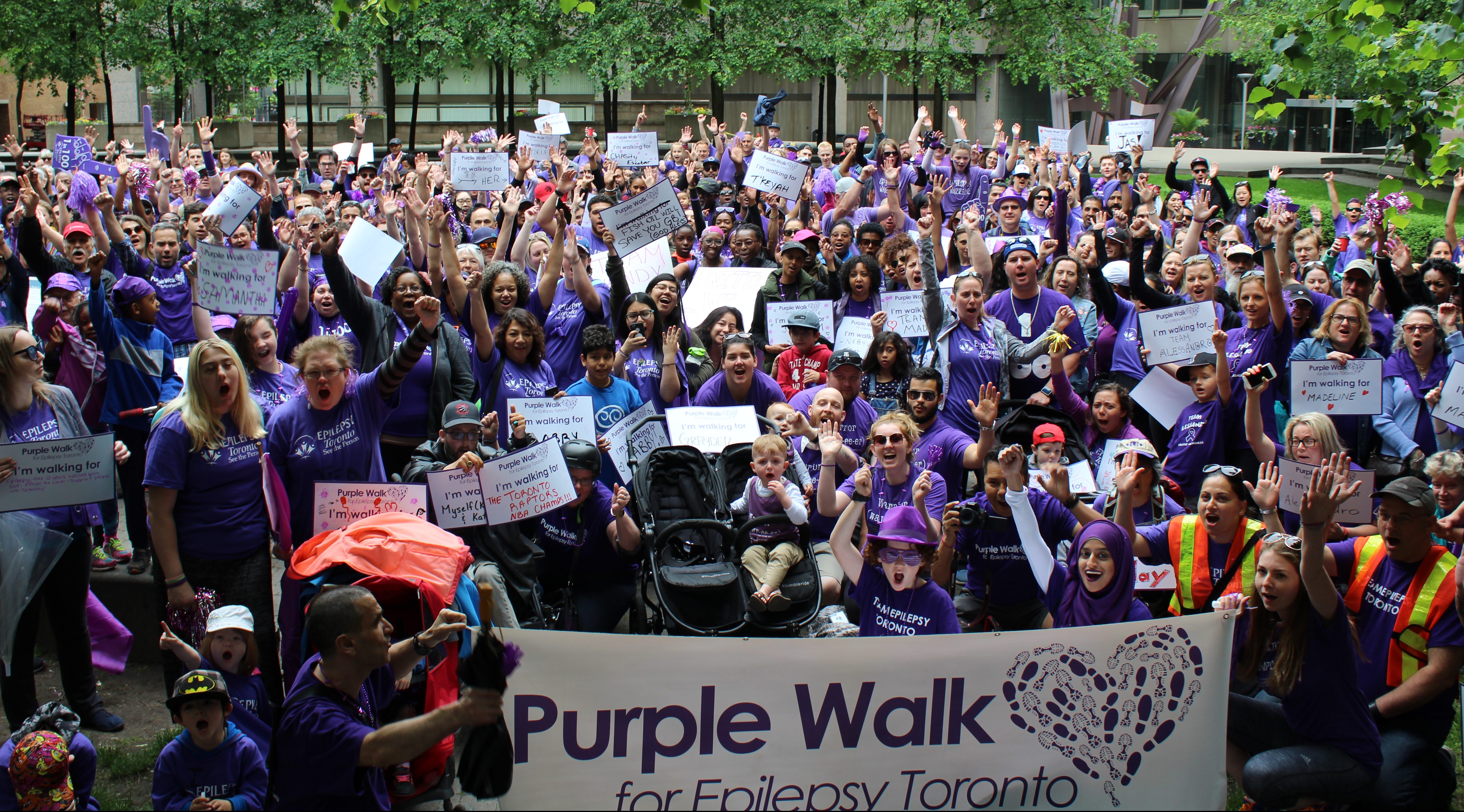 Large group of people walking in the Purple Walk