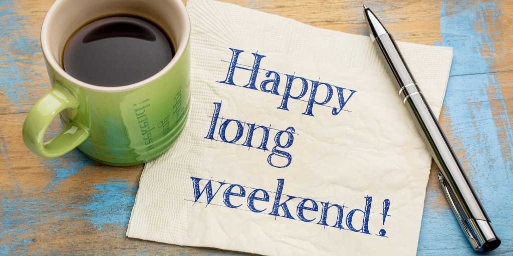 A coffee and a napkin saying "happy Long weekend!"