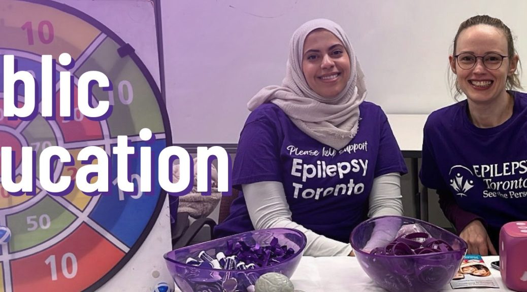 Image of two people at an Epilepsy Toronto information booth at an event.